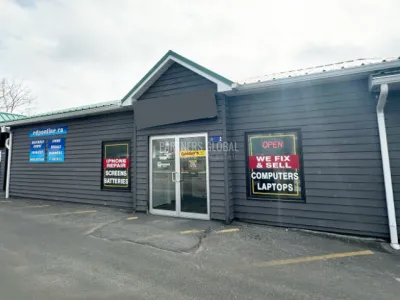 601 Highway 2, Elmsdale, NS, store front with grey older building with partners global logo watermarked